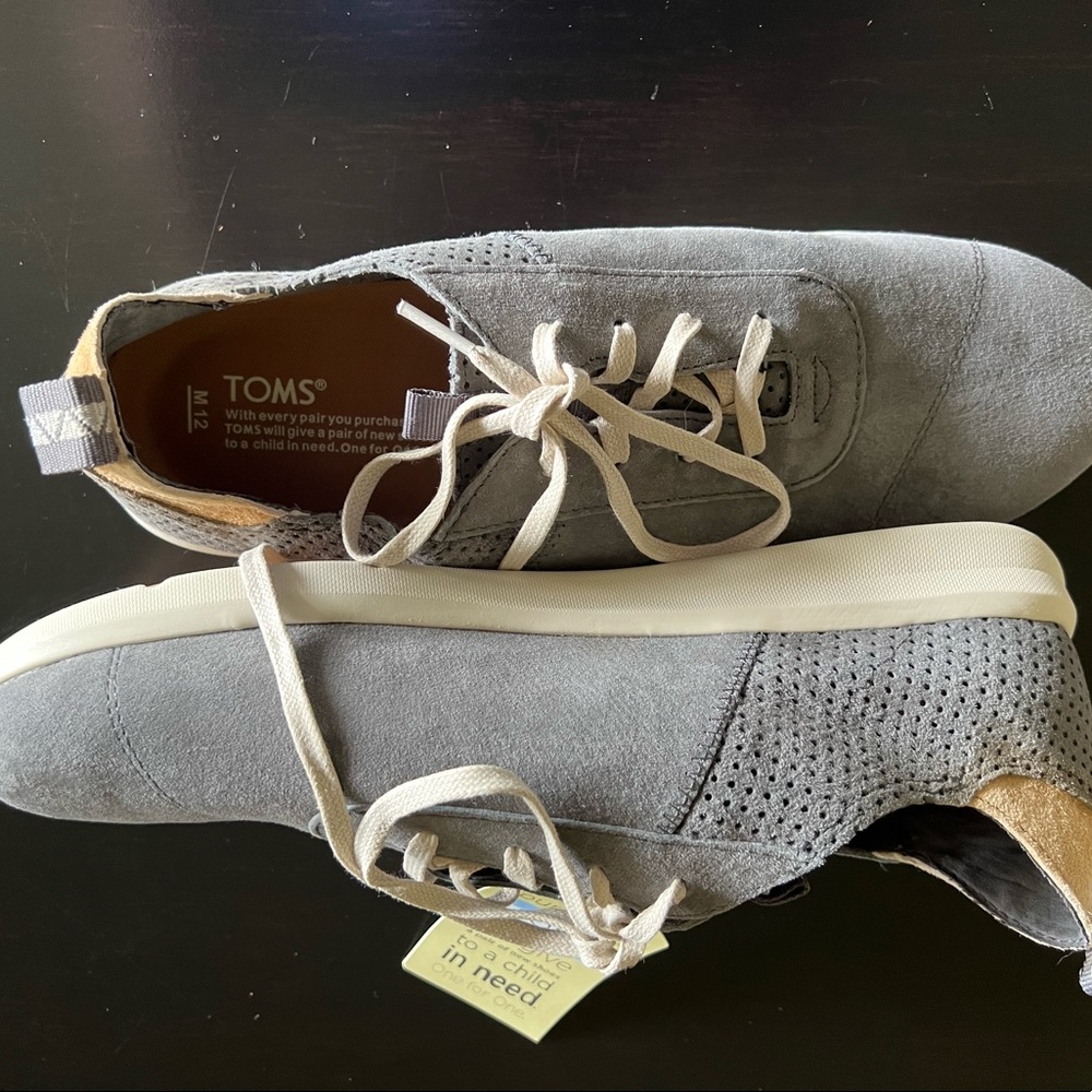 Mens Toms sneakers/shoes. Brand New with tags… clean smoke free home…. Size 12